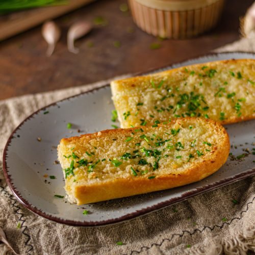 Butter garlic baguette Delicious baguette with butter, parmesan cheese and garlic