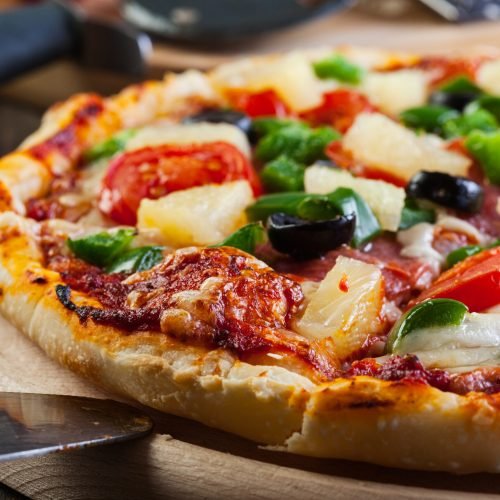 Fresh baked pizza hawaii Fresh baked pizza hawaii on cutting board