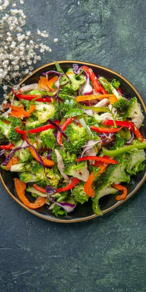 top-view-delicious-vegetable-salad-with-various-ingredients-black-cutting-board top-view-delicious-vegetable-salad-with-various-ingredients-black-cutting-board